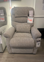 Gray recliner chair with price tags in a store setting